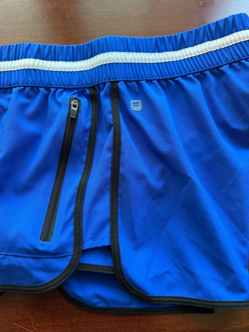 Fabletics Royal Blue Athletic Shorts with White Striped Waistband and Black Trim